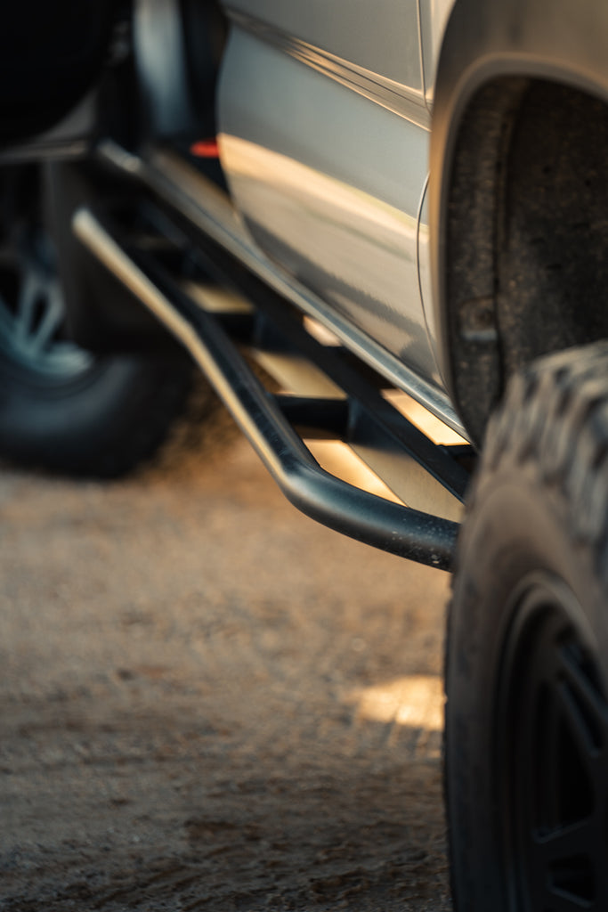 Detail shot of rock sliders installed on Tacoma