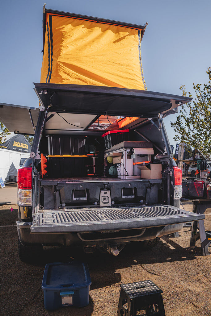 DECKED Drawer System in back of truck with rooftop tent