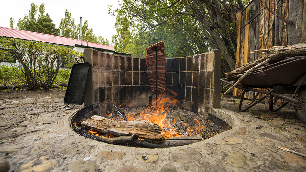 Beef cooking outdoors in the traditional Argentine way