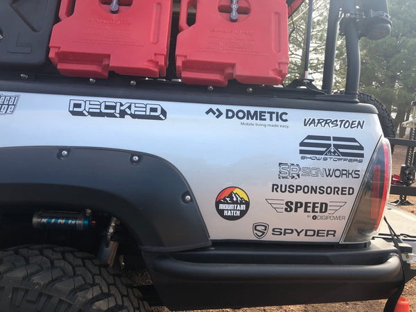 Side view of truck with stickers