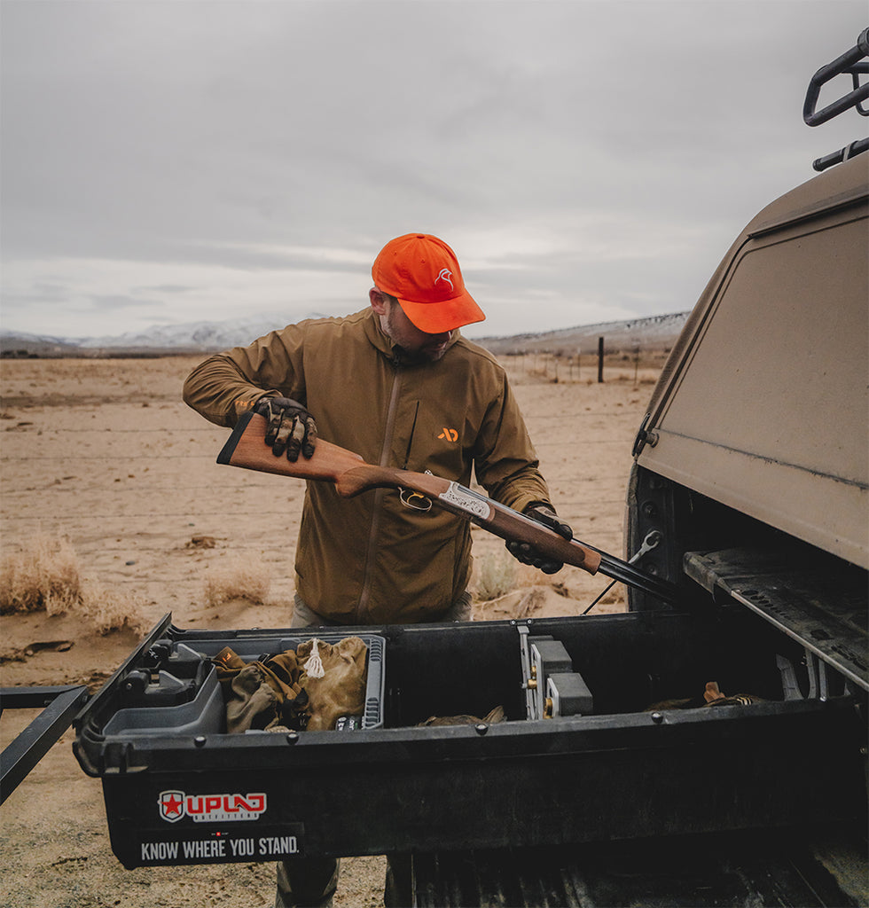 Travis Warren pulls a shotgun out of his DECKED Drawer System