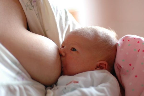 Baby breastfeeding closeup