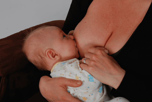 Baby breastfeeding closeup