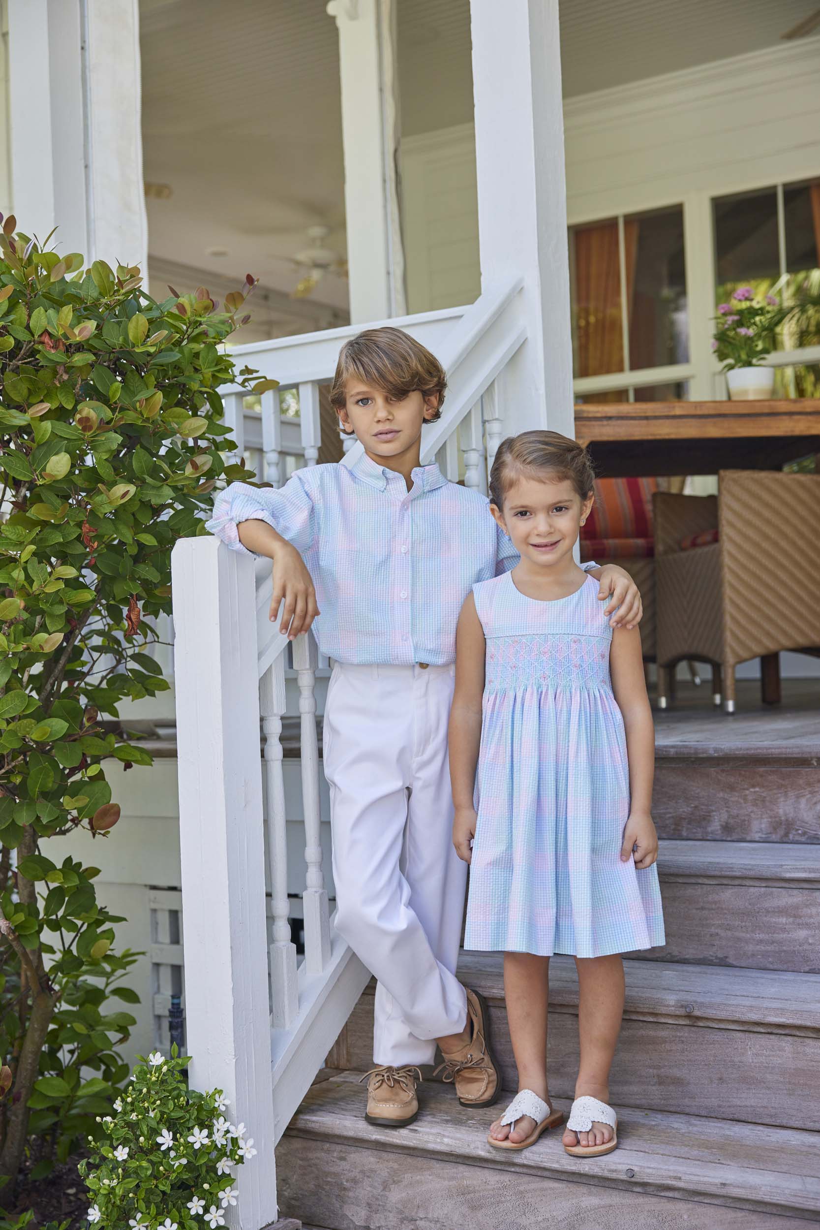 classic childrens clothing girls dress in pink and blue plaid with blue smocking detail