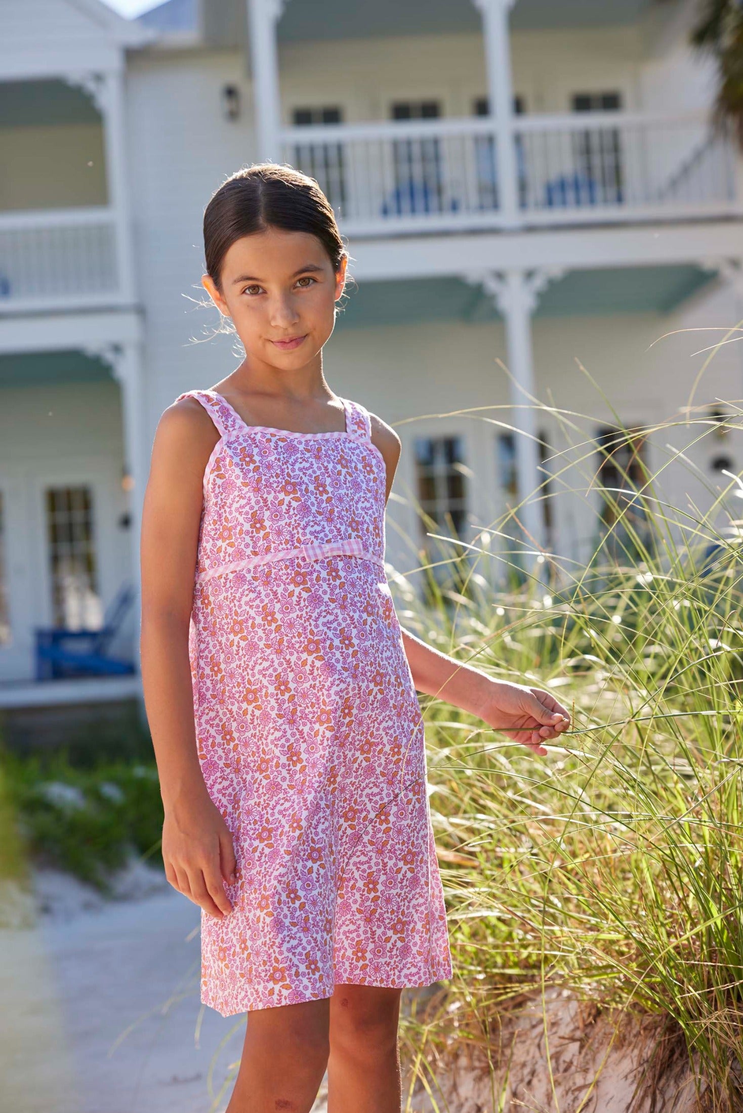 classic childrens clothing girls strappy pink and orange floral dress with pink piping and skinny bow