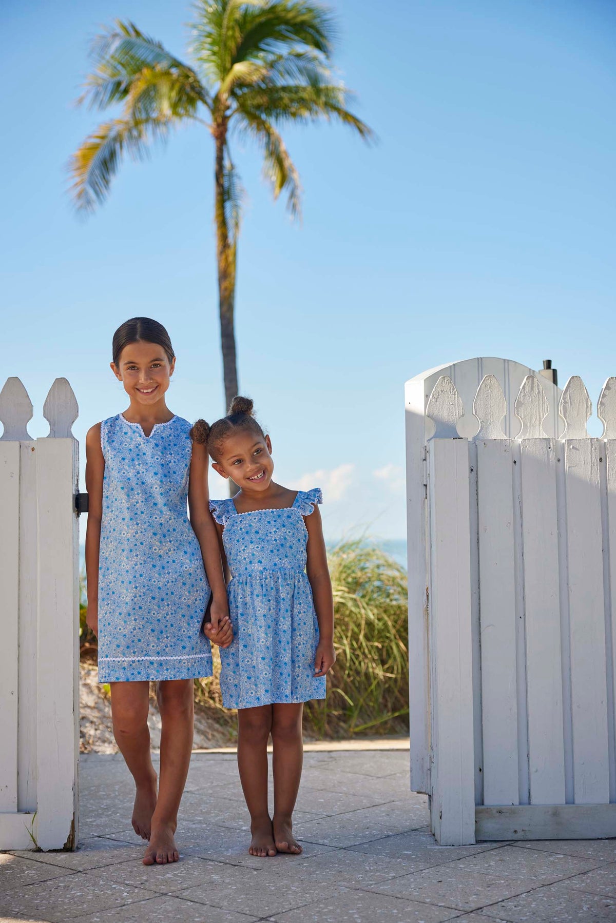 classic childrens clothing girls blue and white floral sundress with ruffled straps and ric rac trim