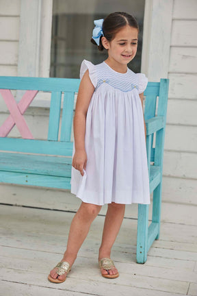 classic childrens clothing girls white dress with ruffle sleeves and blue smocking
