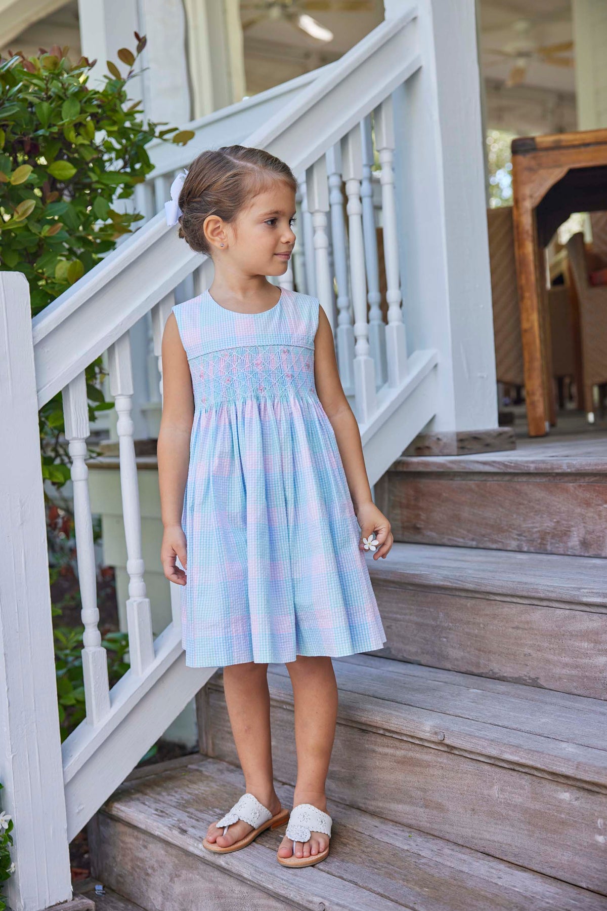 classic childrens clothing girls dress in pink and blue plaid with blue smocking detail