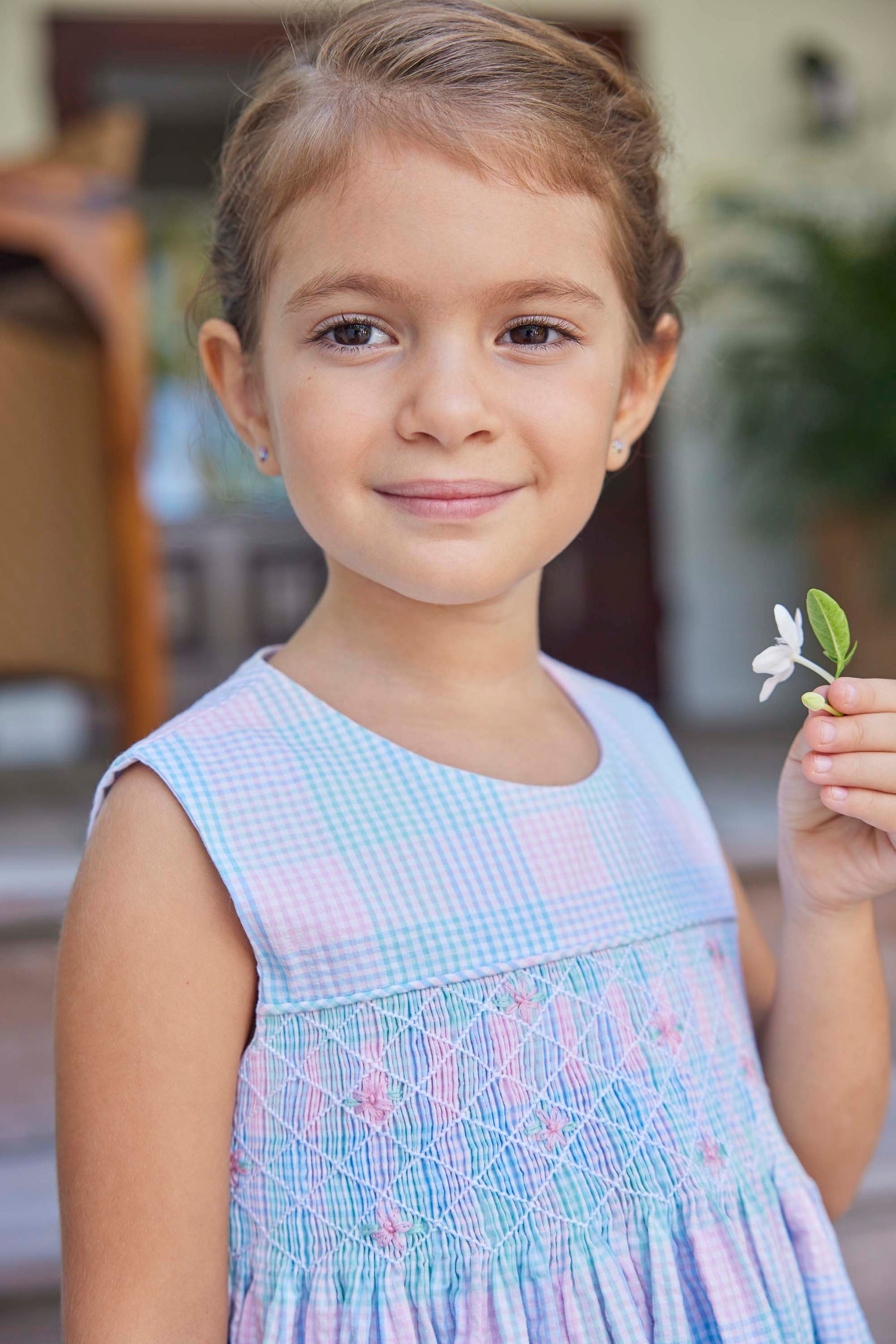 classic childrens clothing girls dress in pink and blue plaid with blue smocking detail