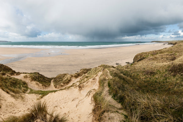 sand dunes stormy sky