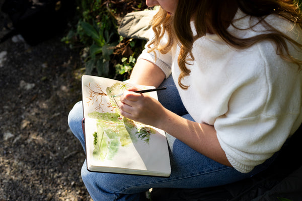 Artist painting in the sunshine