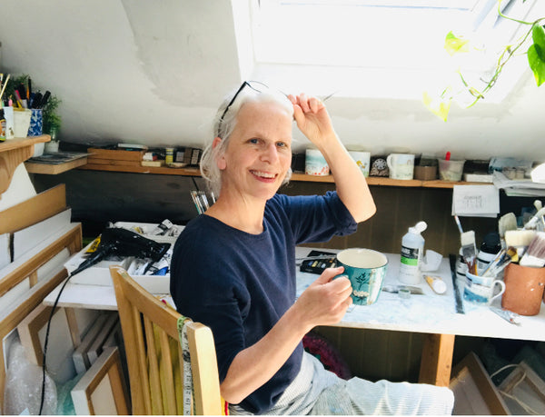 picture of hannah cole in her art studio in the loft