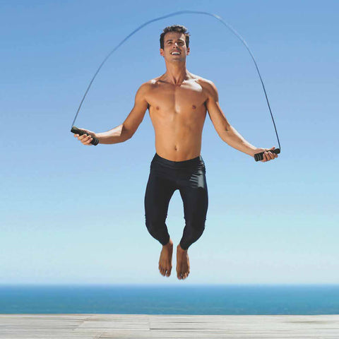 Male athlete using a jump rope