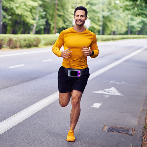 Male runner on the road with a waist pack on