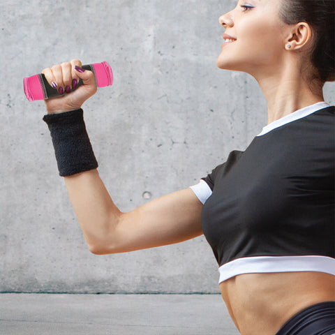 Female athlete holding a walking hand weight