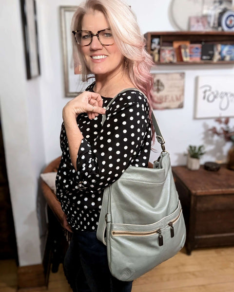 Handbag designer Brynn Capella with her Signature bag in Seabreeze