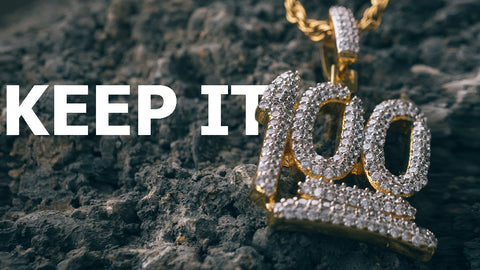 18k Gold Iced Out Cubic Zirconia Emoji 100 Hip Hop Pendant shot outdoors