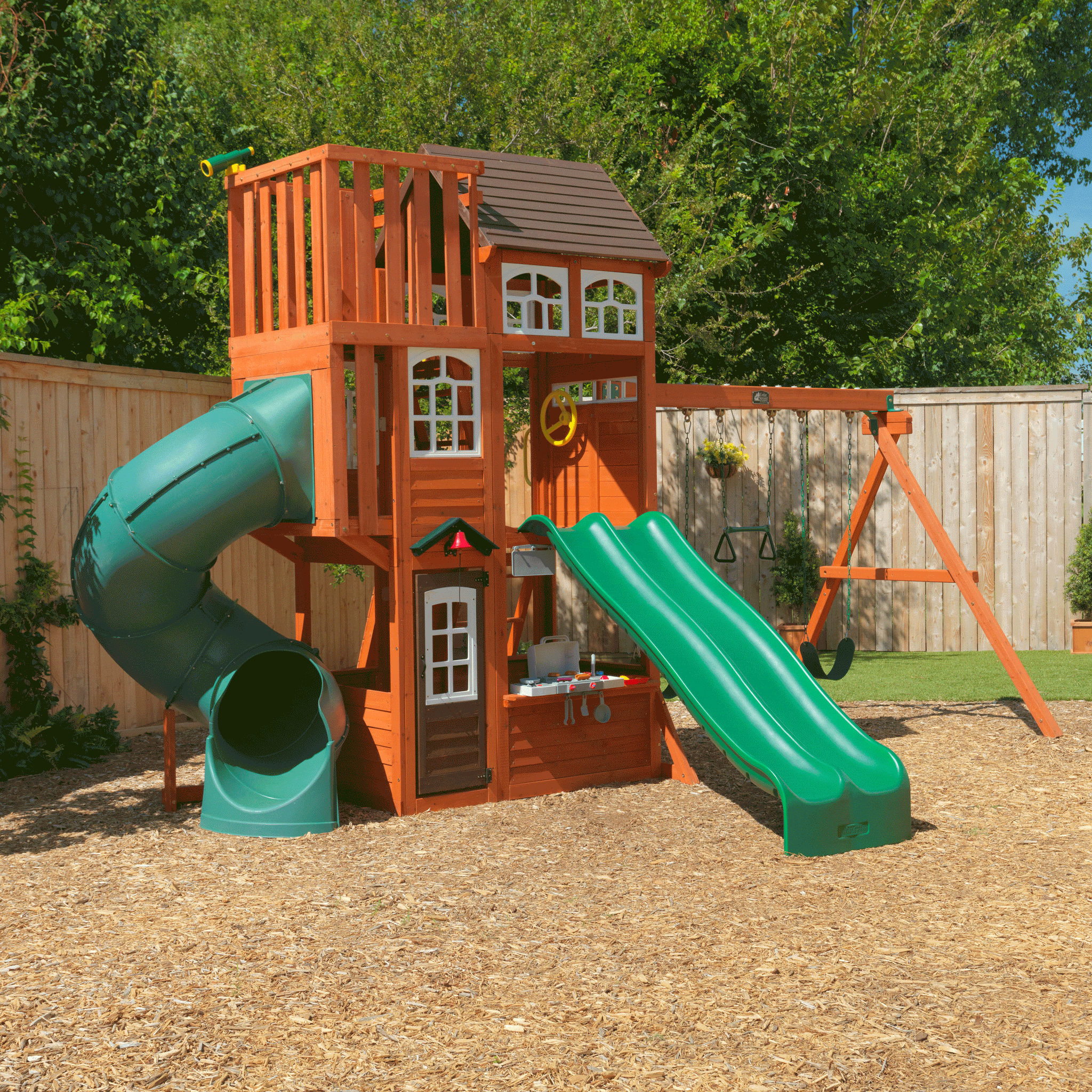 wooden playhouse with slide and swing