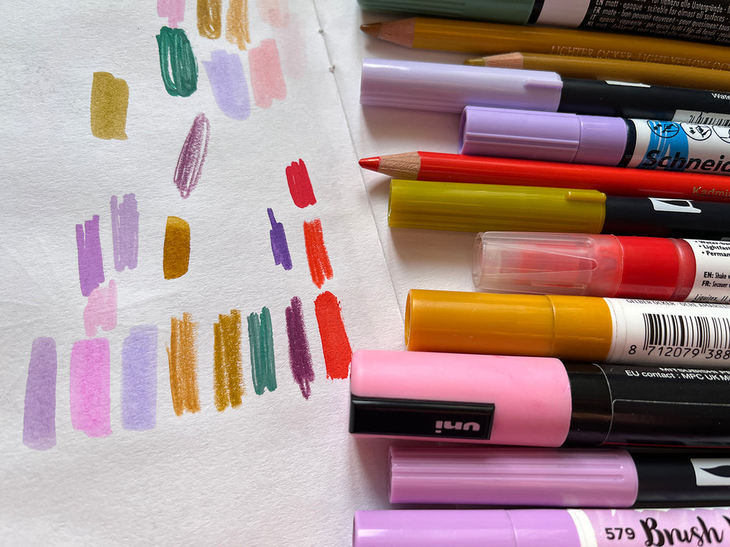 Pens lined up with colour swatches