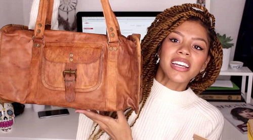 tasha green with a vida vida duffel bag