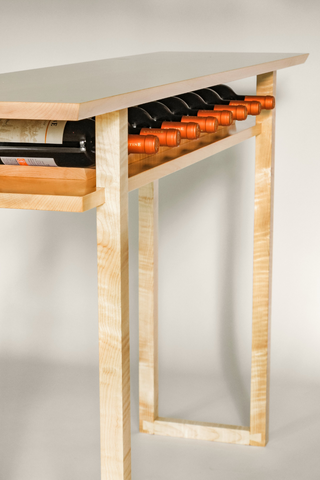 The Tasting Table by Mokuzai Furniture is a minimalist dining room console table with an elegant wine storage solution.