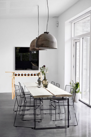 A minimalist dining room gets a special addition with the Tasting Table from Mokuzai Furniture.