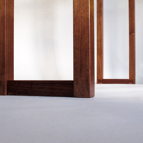 hand-cut dovetail feet on a walnut console table by Mokuzai Furniture