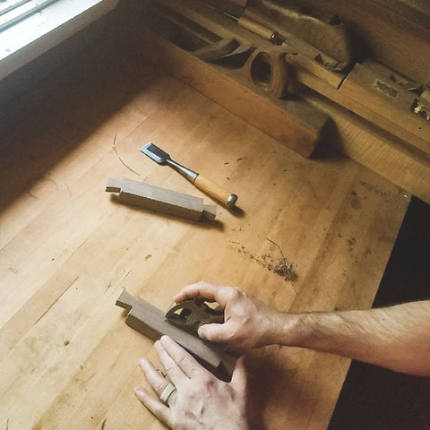 detailing dovetails for a custom console table at Mokuzai Furniture.