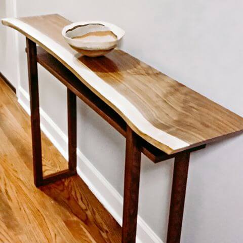 organic shape of a live edge walnut console table by Mokuzai Furniture
