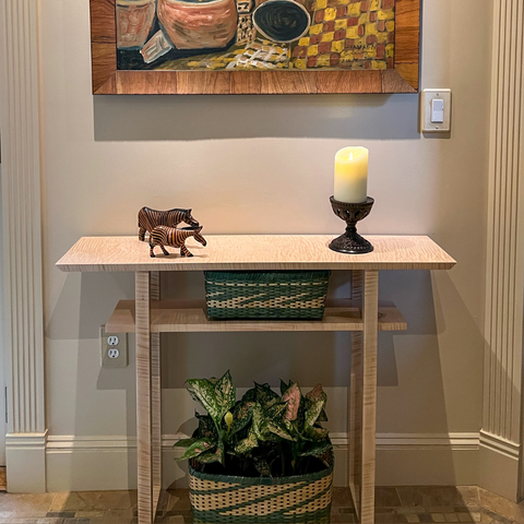 A small console table in tiger maple that was hand-crafted by Mokuzai Furniture.