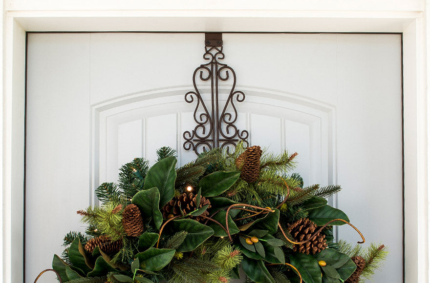 Colonial Wreath Hanger Hanging On A Door