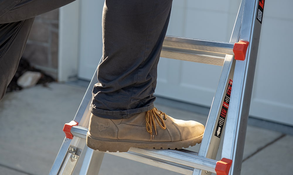 using ladder to hang christmas lights