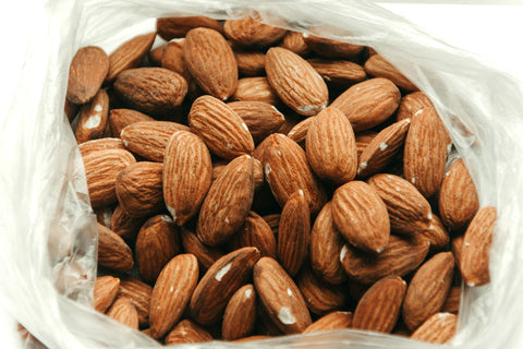 Close-up of almonds inside a bag.
