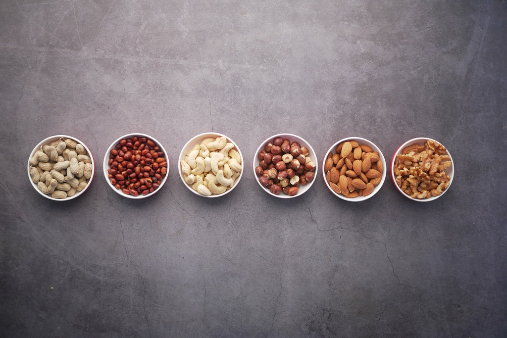 Different bowls of nuts.