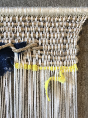 Oly-Fun lemon drop woven into wall hanging