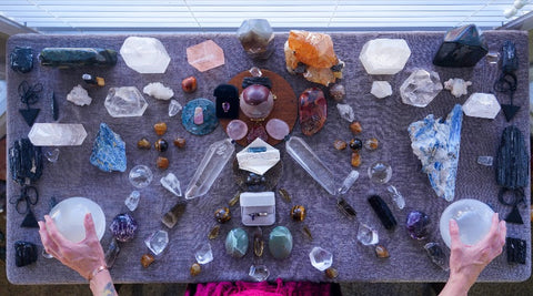 Crystals on Altar with hands holding Selenite Spheres