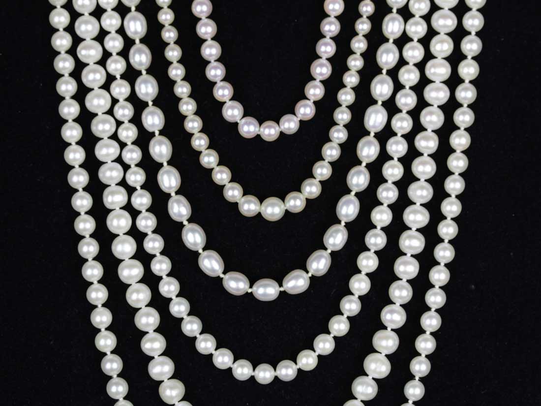 Layered pearl necklaces