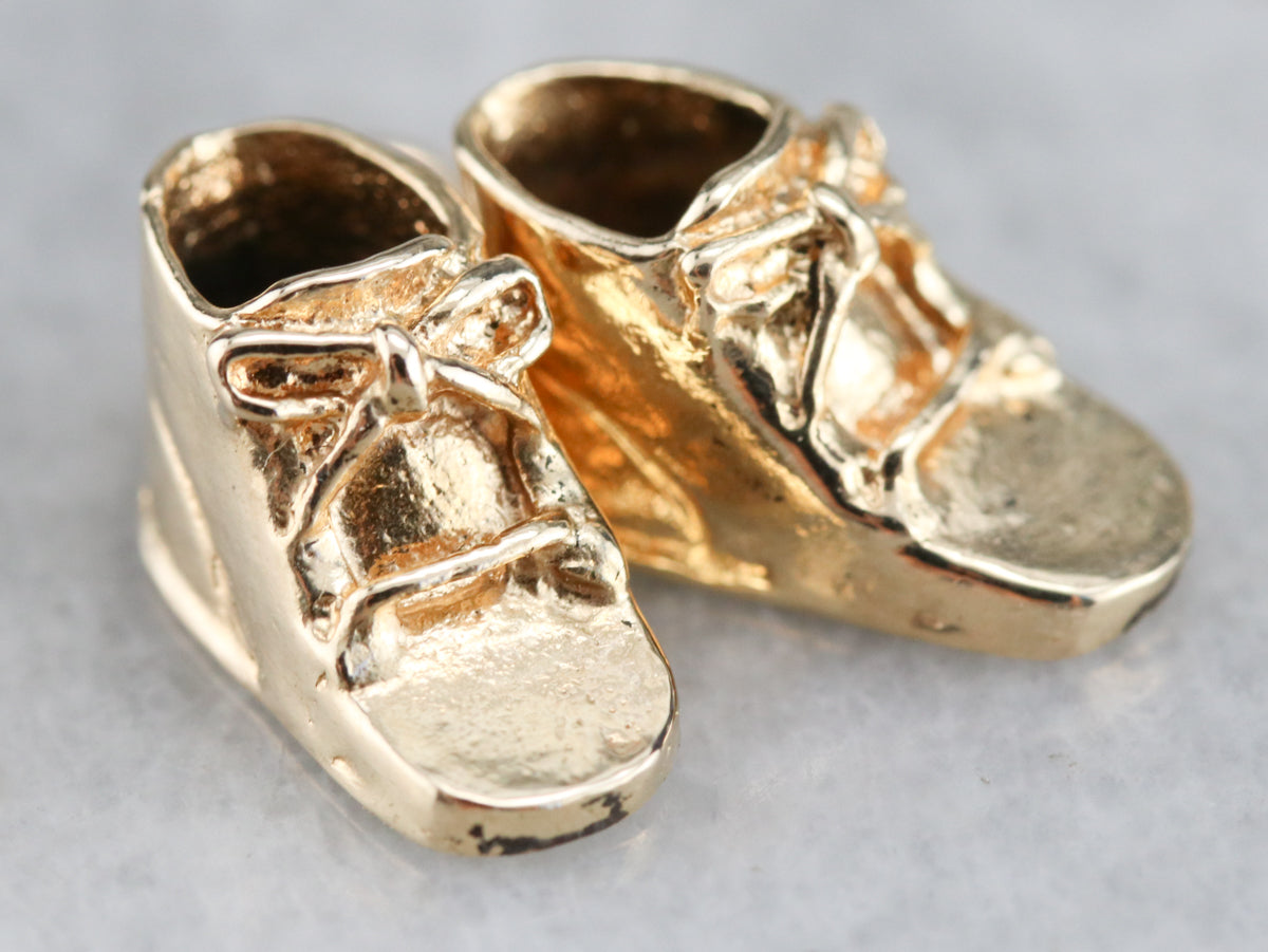 gold baby booties