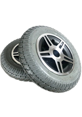 a pair of gray drive tires with chrome rims