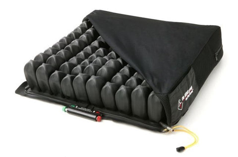 a Roho wheelchair seat cushion with the cover unzipped partially to show a grid of filled black air bladders inside