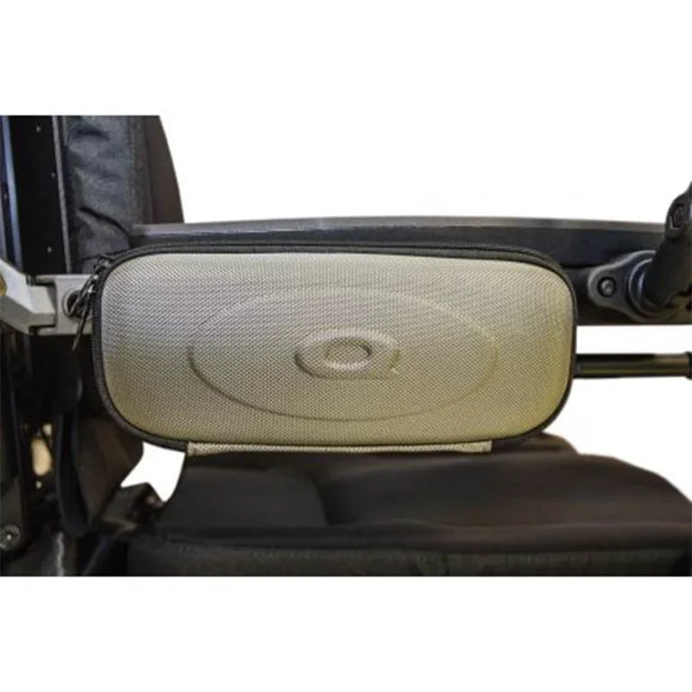 a photo of a Quantum power wheelchair 'glove box' attached just beneath the armrest on the wheelchair