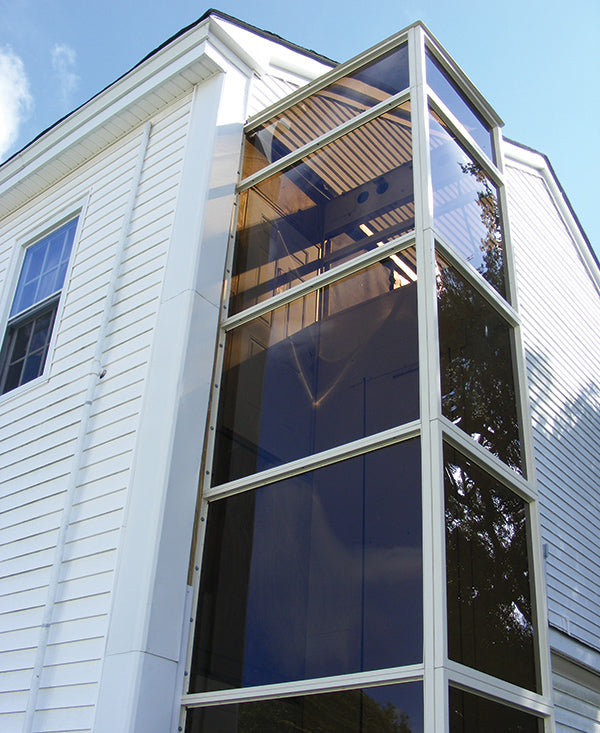 vertical platform lift encased in glass