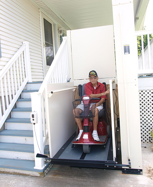 elderly man using vertical platform lift