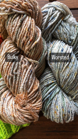two skeins of pleiades yarn in worsted and bulky. The one on the left is browny speckled, and the one on the right is greenish speckled.