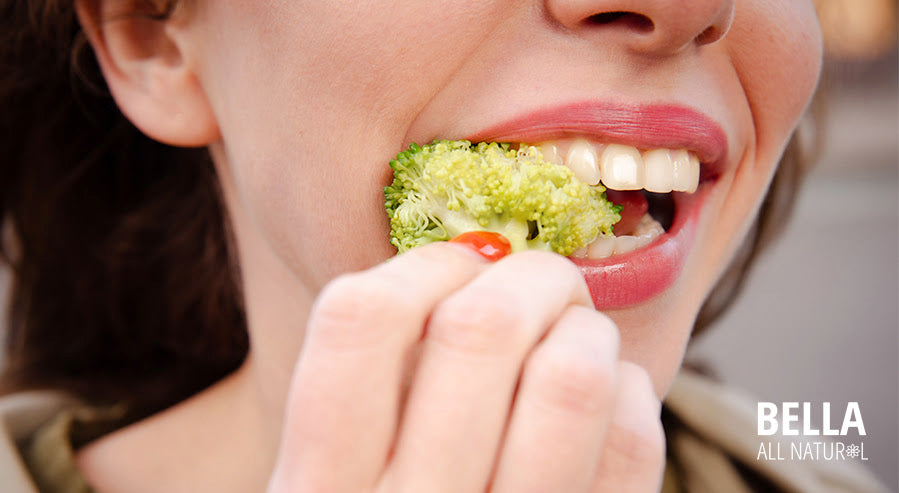 A Person Eating Broccoli