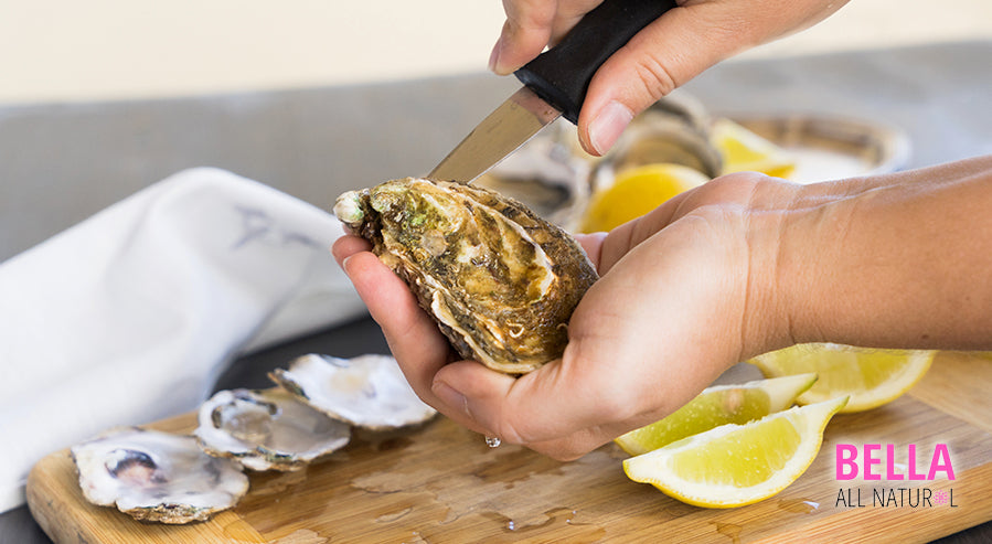 A Person Shucking Oysters