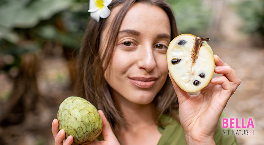 A Woman Holding a Soursop Fruit