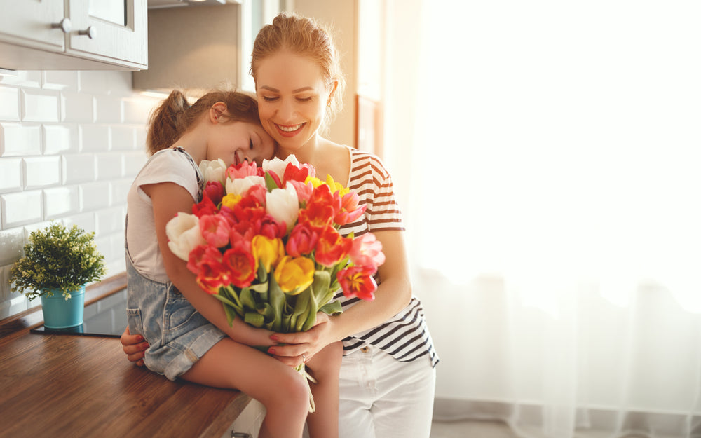 daughter and mother with flowers