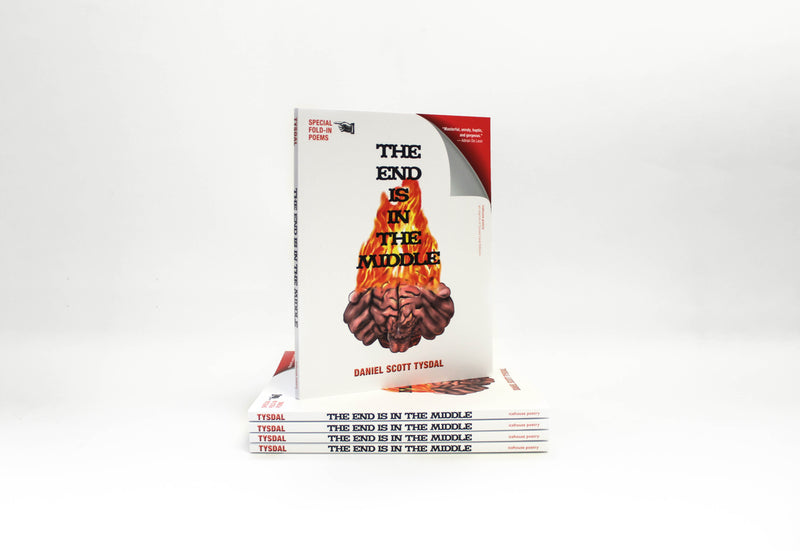 A copy of the book, The End Is in the Middle, stands atop a neat stack of copies against a white backdrop.
