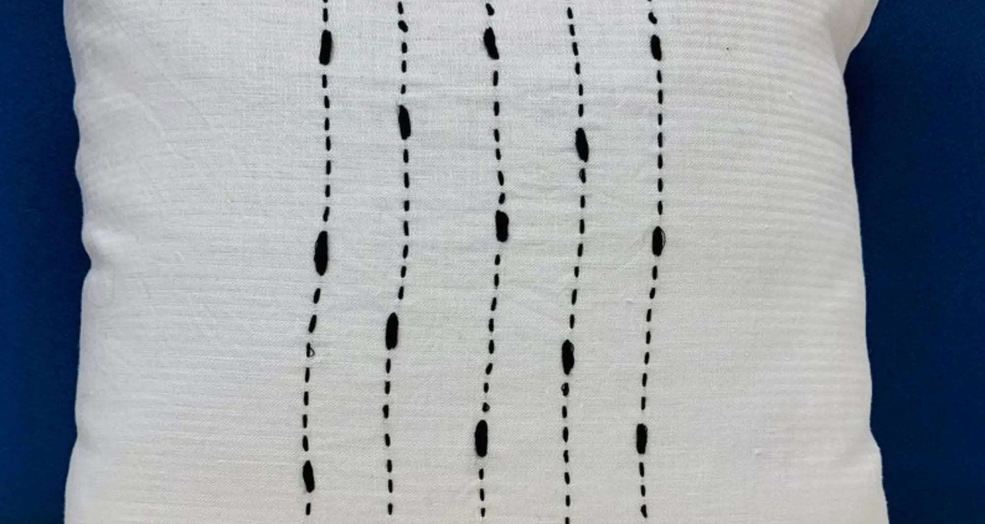 A  white hemp banana fabric with stitches on it
